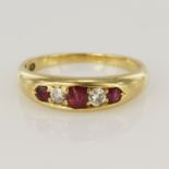 Yellow gold (tests 18ct) diamond and ruby ring, three graduating rubies, principle measures 3.5 x