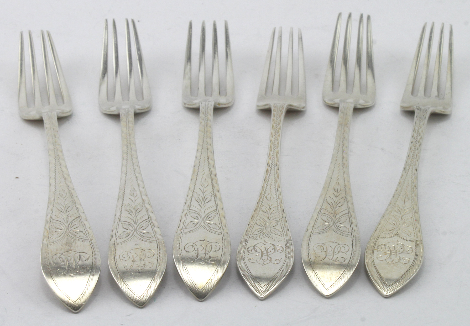 Six matching Danish silver bright-cut, oar- end pattern dessert forks marked for I Holm, Coppenhagen