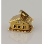 Yellow gold (tests 18ct) vinatge articulated house charm, opens to revel two enamelled red hearts