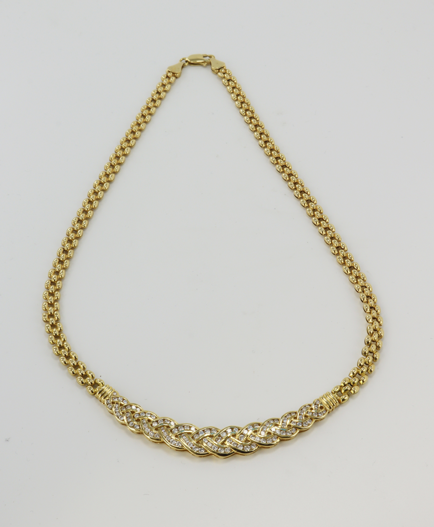 Yellow gold (tests 18ct) diamond set collar necklace, plait style pendant channel set with diamonds,