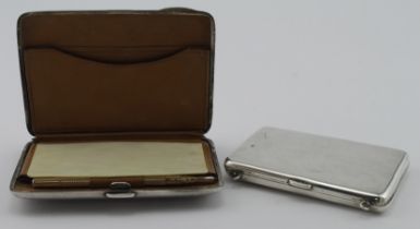 Two silver card cases,( both have their innards) hallmarked Chester, 1902 & Birm. 1913 (the 1913
