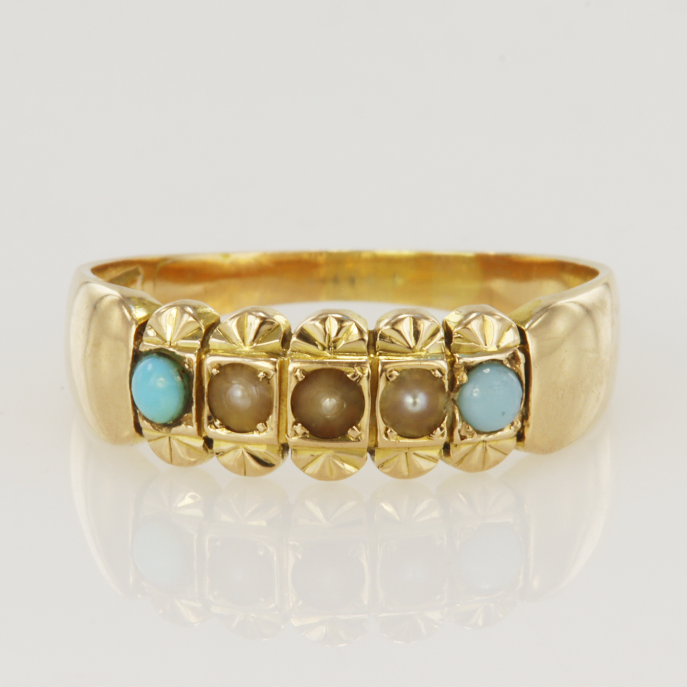 15ct yellow gold band ring set with three 2mm diameter seed pearls and two 2.5mm diameter