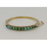 Yellow gold (tests 9ct) antique diamond and turquiose bangle, thirteen graduating turquoise,