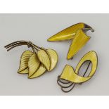 Three Scandinavian silver yellow enamelled brooches, total weight 36.7g.