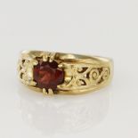 9ct yellow gold gypsy dress ring, set with red paste, filigree shoulders, head width 9.5mm, finger