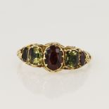 Yellow gold (tests 14ct) antique spinel and zircon ring, set with three graduating red spinels