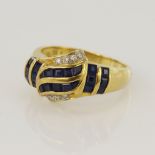 Yellow gold (tests 18ct) diamond and sapphire dress ring, twenty-two calibre cut sapphires, eight