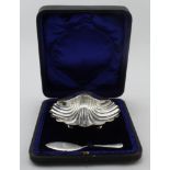 Silver shell shaped butter dish plus silver butter knife in original box the two silver items are