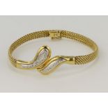 18ct yellow gold contemporary serpent style diamond bracelet, diamonds highlighted in white gold,