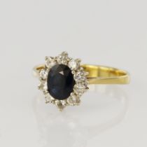 Yellow gold (tests 18ct) diamond and sapphire cluster ring, one oval sapphire measures approx. 6.