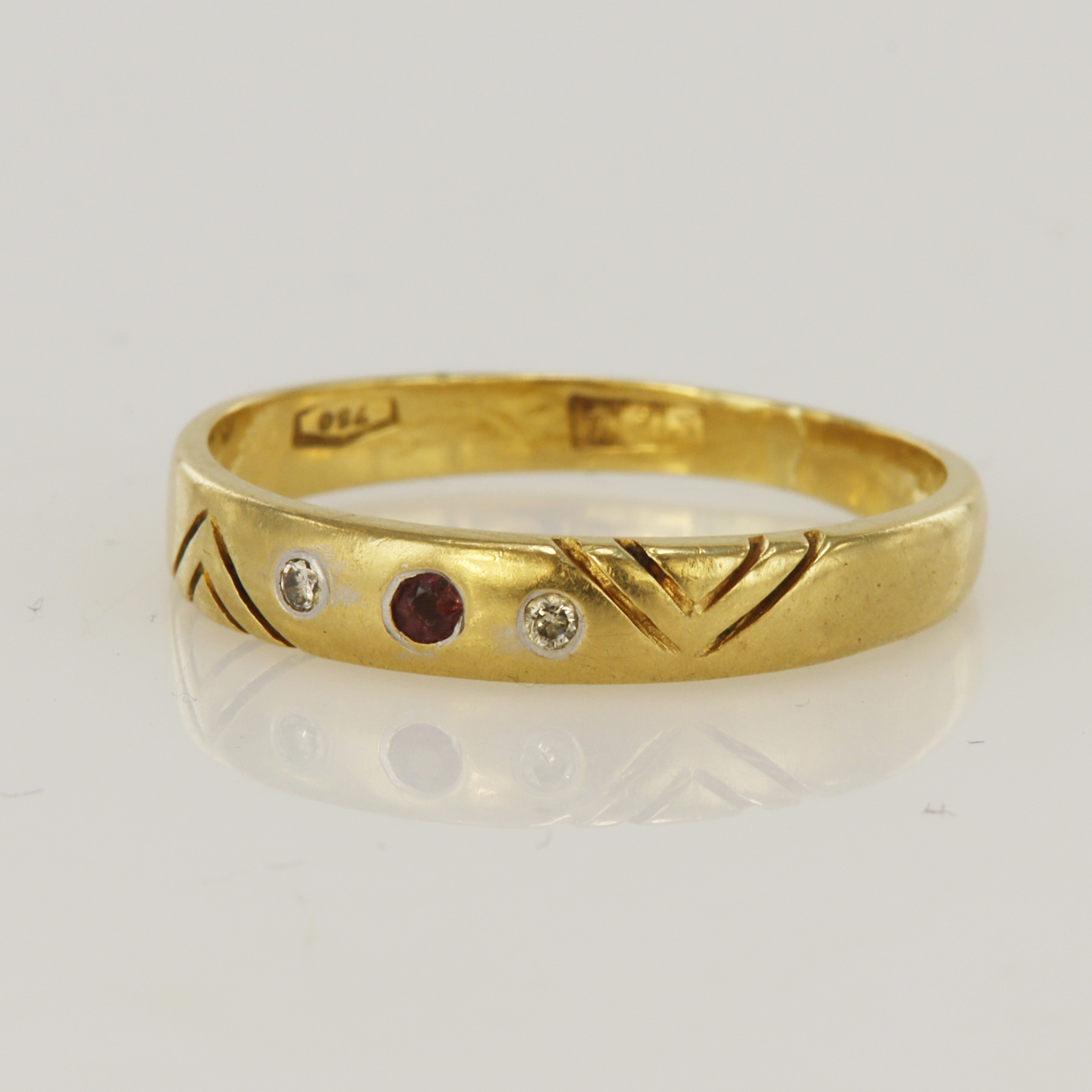 Yellow gold (tests 18ct) diamond and ruby set band, one ruby approx. 2mm, two diamond TDW approx.