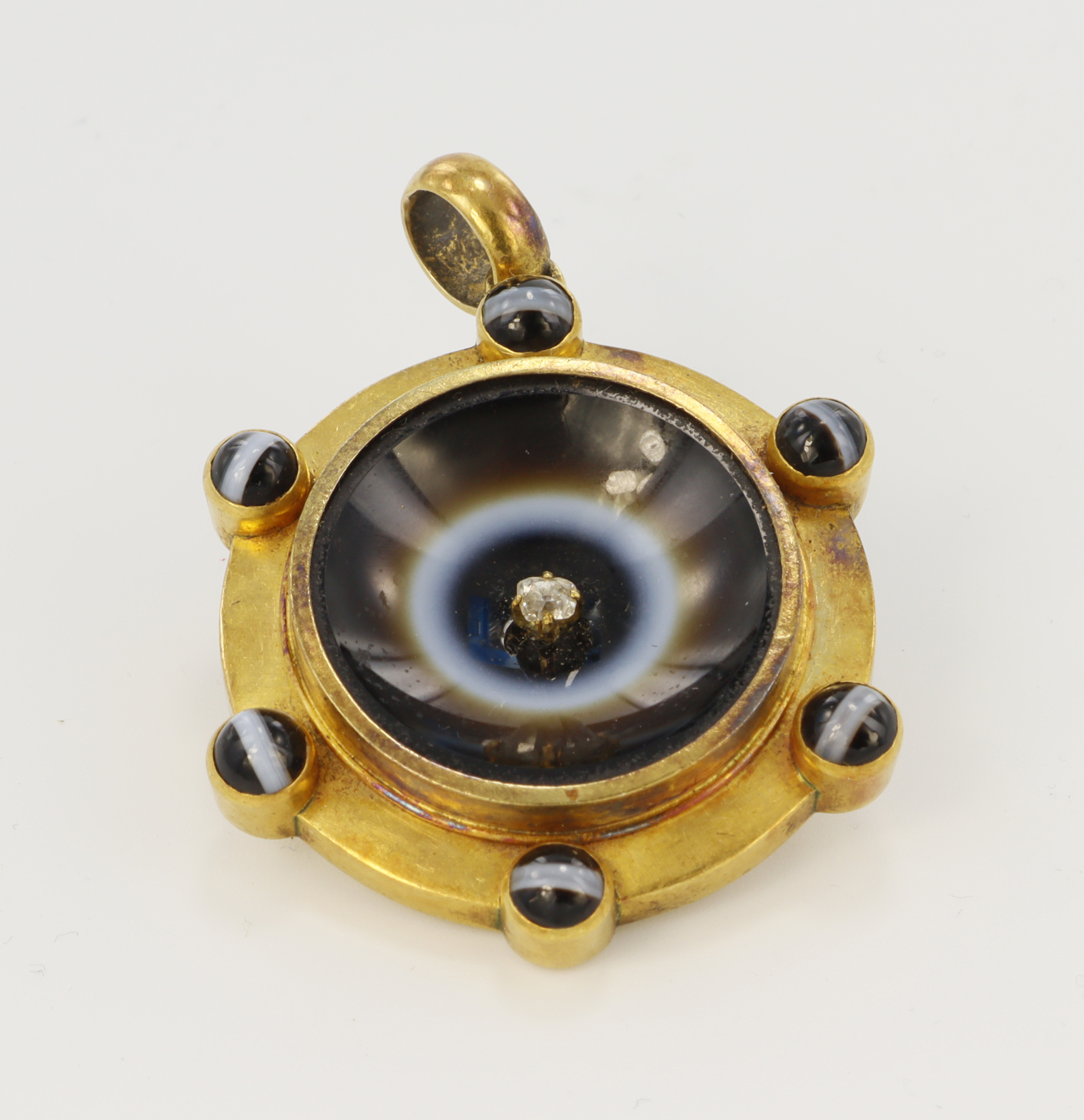 Yellow metal Victorian diamond and banded agate mourning locket, center old cut diamond approx. 0.