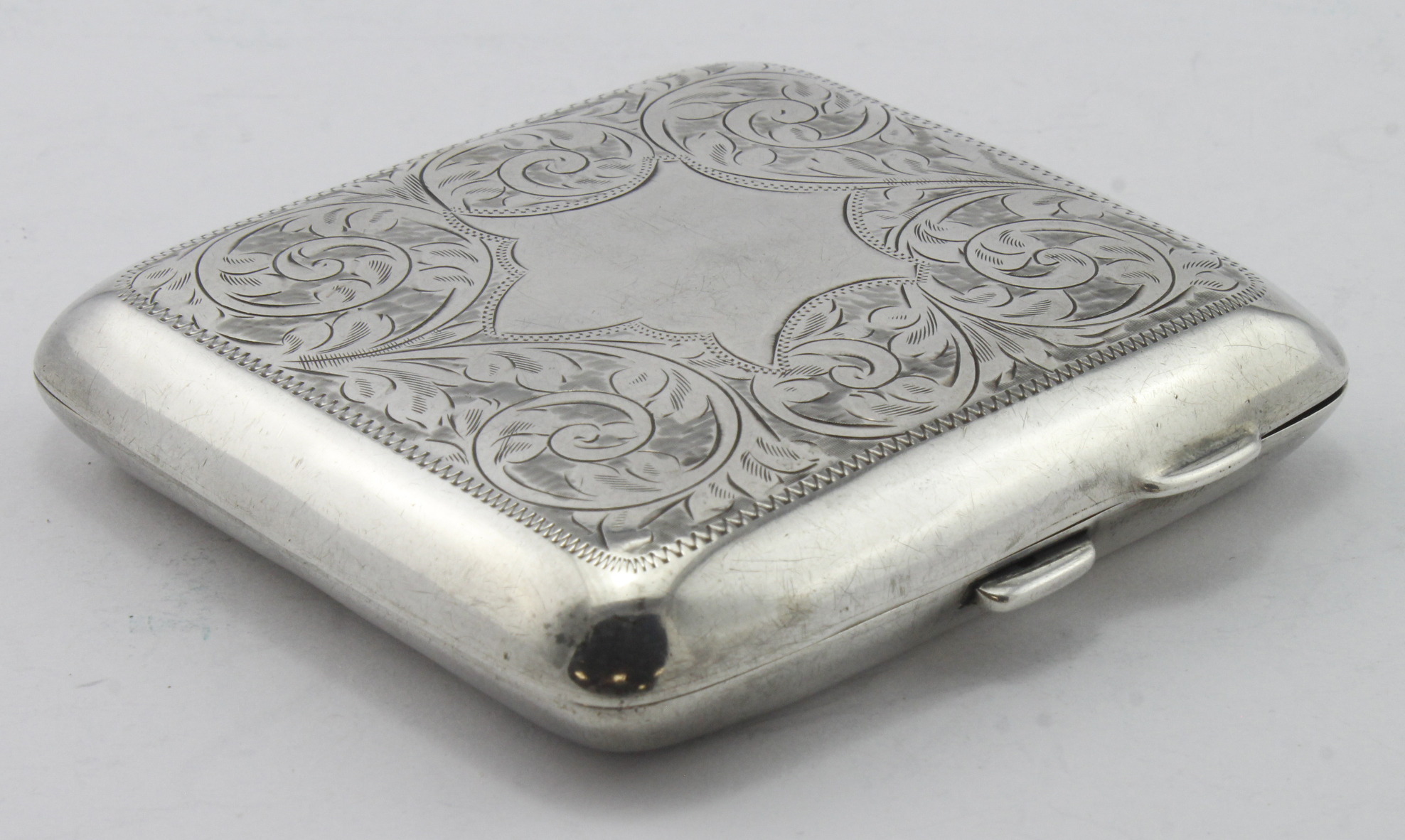 Silver engraved cigarette case hallmarked T&S Chester 1919, weights 3.25oz approx.