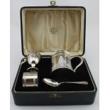 Attractive boxed silver Christening set comprising a mug, napkin ring, egg cup and spoon, all