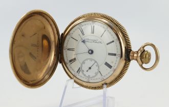 Gents gold plated full hunter stem-wind pocket watch by Waltham. The signed white enamel dial with