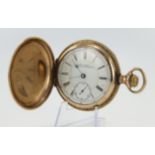 Gents gold plated full hunter stem-wind pocket watch by Waltham. The signed white enamel dial with