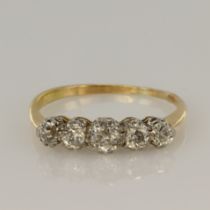 18ct yellow and white gold graduated five stone ring set with five round old cut diamonds with an