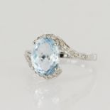 18ct white gold dress ring featuring an oval chequerboard cut blue topaz measuring approx. 10mm x