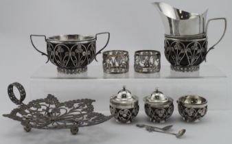 Mixed lot of Indian, unmarked silver coin type items comprising cream jug, sugar bowl, leaf shaped