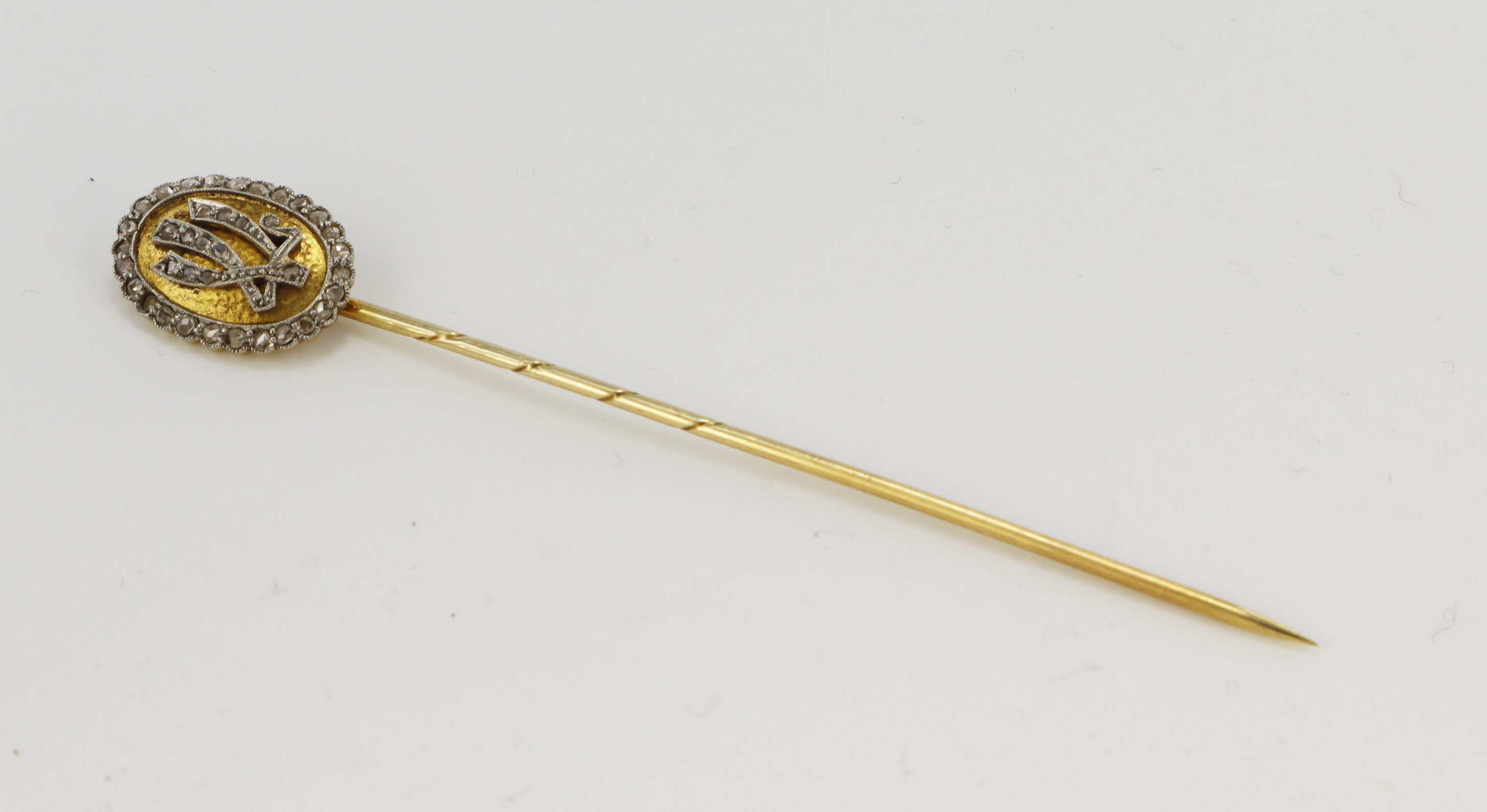 Yellow gold (tests 14ct) antique diamond monogram stick pin, 'LV' monogram and surround set with