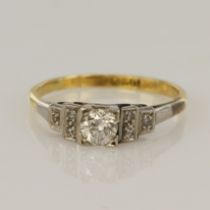 Yellow gold (tests 18ct) vintage diamond dress ring, one round brilliant cut approx. 0.27ct, flanked