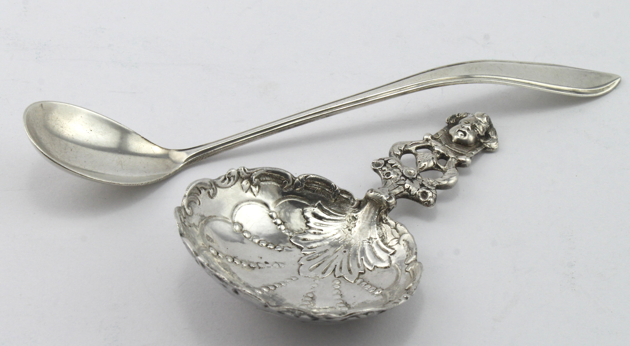 Two Continental silver spoons comprising a Bernard Mueller Christening? Spoon re-hallmarked London