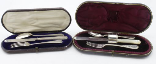 Two boxed silver Christening sets comprising knife, fork & spoon and knife, fork, spoon & napkin