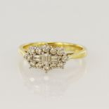 18ct yellow gold diamond cluster ring, three baguette cut diamonds, surrounded by twelve round