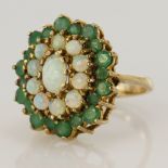 9ct yellow gold emerald and opal cluster dress ring, principle oval opal measures 7 x 5mm,