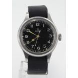 Omega British Military RAF Pilots wristwatch, circa 1956. The black dial with Arabic numerals. The