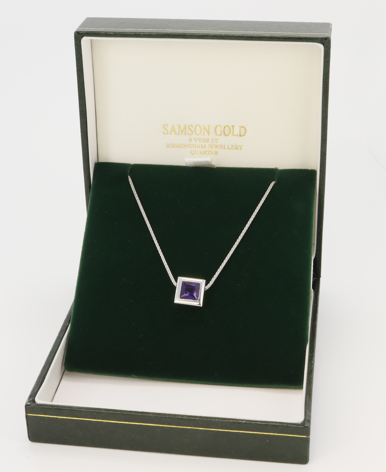 18ct white gold/tests 18ct amethyst pendant and chain, square amethyst measures approx. 6mm, heavy