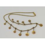 Yellow gold (tests above 18ct) vintage split pearl necklace, eleven graduating articulated floral