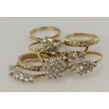 Eight 9ct gold/tests 9ct CZ rings, finger sizes include K/L, L/M, M, Nx2,O, P, Q, total weight 18.