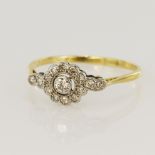Yellow gold (tests 18ct) vintage diamond daisy cross over ring, principle round brilliant approx.