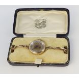 9ct yellow gold mechanical wrist watch (working when catalogued) on 9ct rose gold sprung bracelet