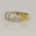 Yellow gold (tests 18ct) diamond trilogy ring, three round brilliant cuts, principle approx. 0.43ct,