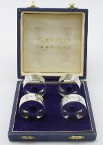 Four silver napkin rings(boxed) with four different sets of hallmarks for Birmingham, Edinburgh,