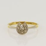 Yellow gold (tests 18ct) vintage diamond horseshoe ring, set with seven single-cuts and one old
