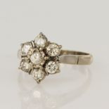 White gold (tests 18ct) diamond cluster ring, seven round brilliant cuts TDW approx.0.70ct, head