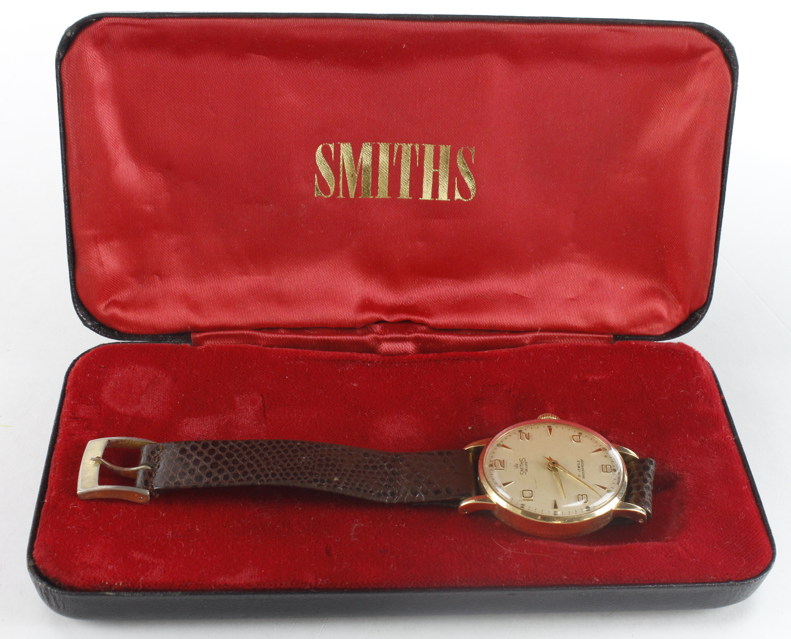 Gents 9ct cased Smiths De Luxe manual wind wristwatch, circa 1962. The creamed dial with alternating