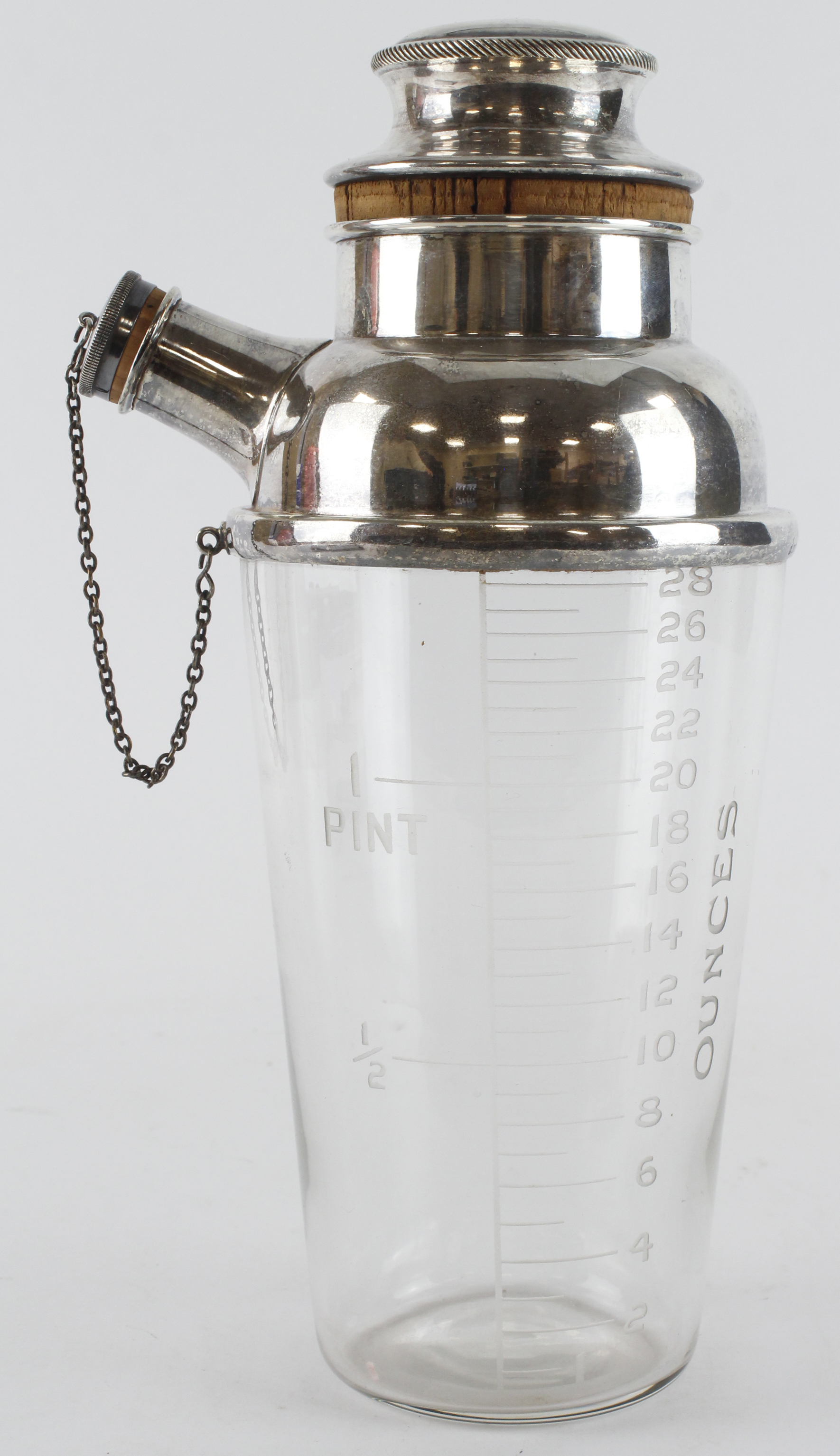 Silver plated cocktail shaker by Dunhill, cork plugged cover and spout. Signed 'Dunhill' along