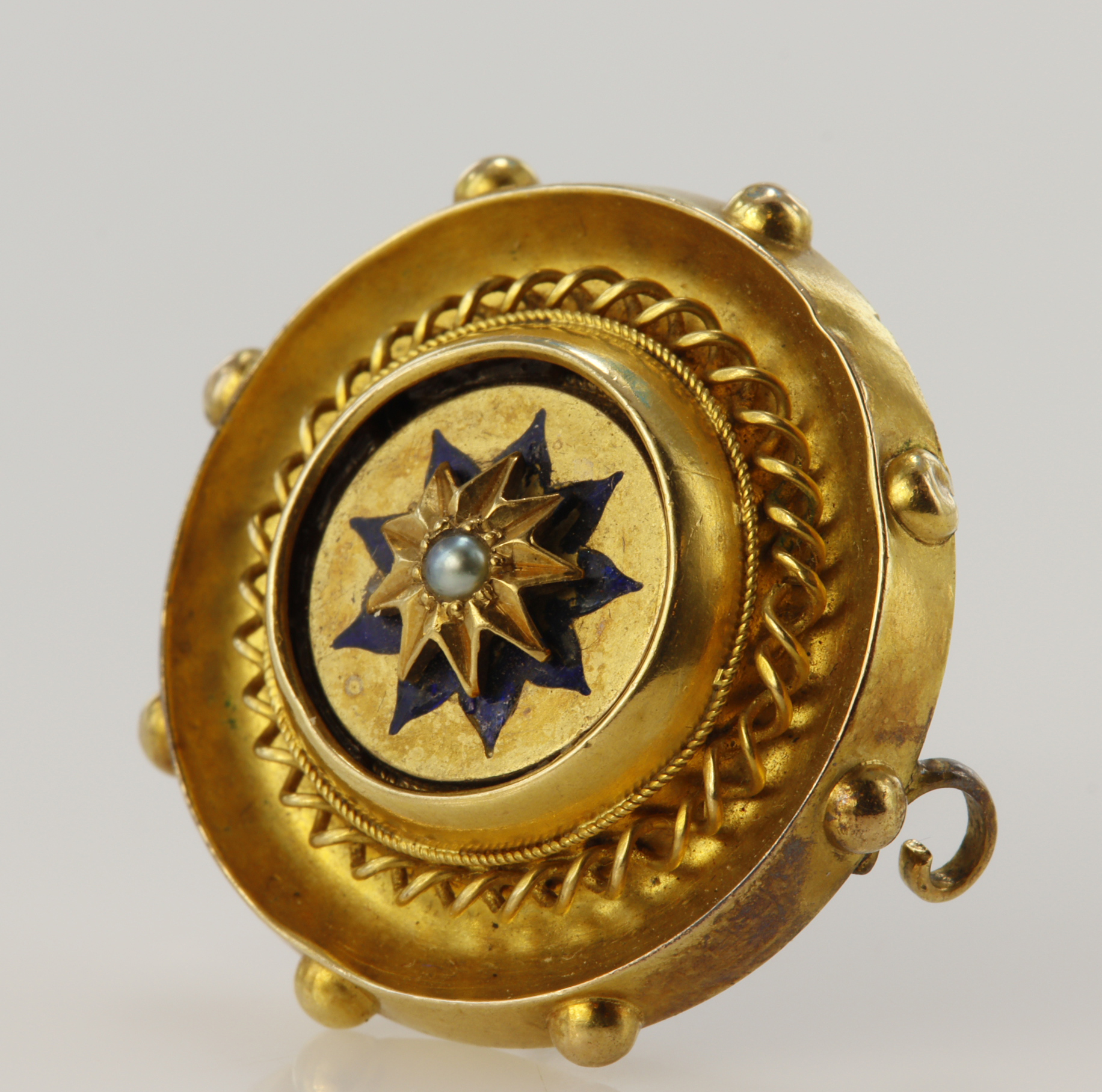 Yellow gold (tests 18ct) Victorian Etruscan Revival mourning brooch, seed pearl set star motif