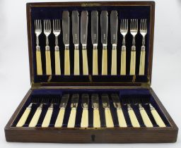 Boxed set of twelve bone handled and silver fish knives and forks, eleven of the handles show some