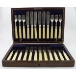 Boxed set of twelve bone handled and silver fish knives and forks, eleven of the handles show some