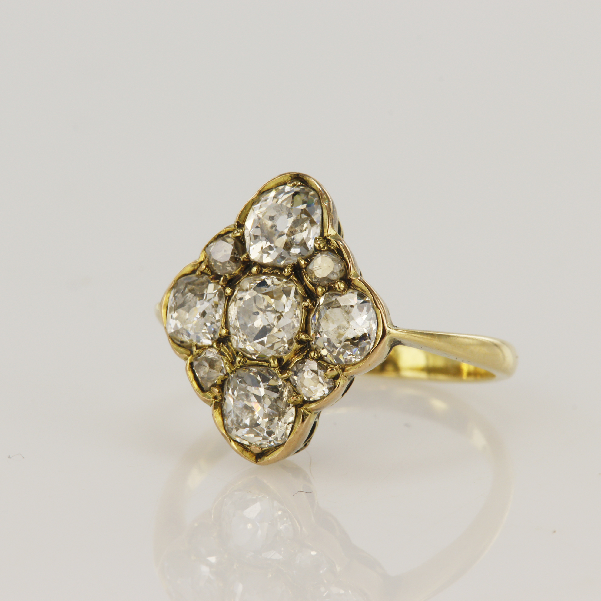 Yellow gold (tests 18ct) antique diamond lozenge shaped cluster ring, nine old mine cuts, TDW
