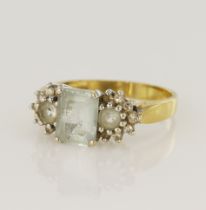 18ct yellow gold diamond and aquamarine dress ring, principle aquamarine measures 8 x 6mm,