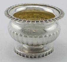 Attractive George III silver salt of circular form with a gadrooned border, base engraved with