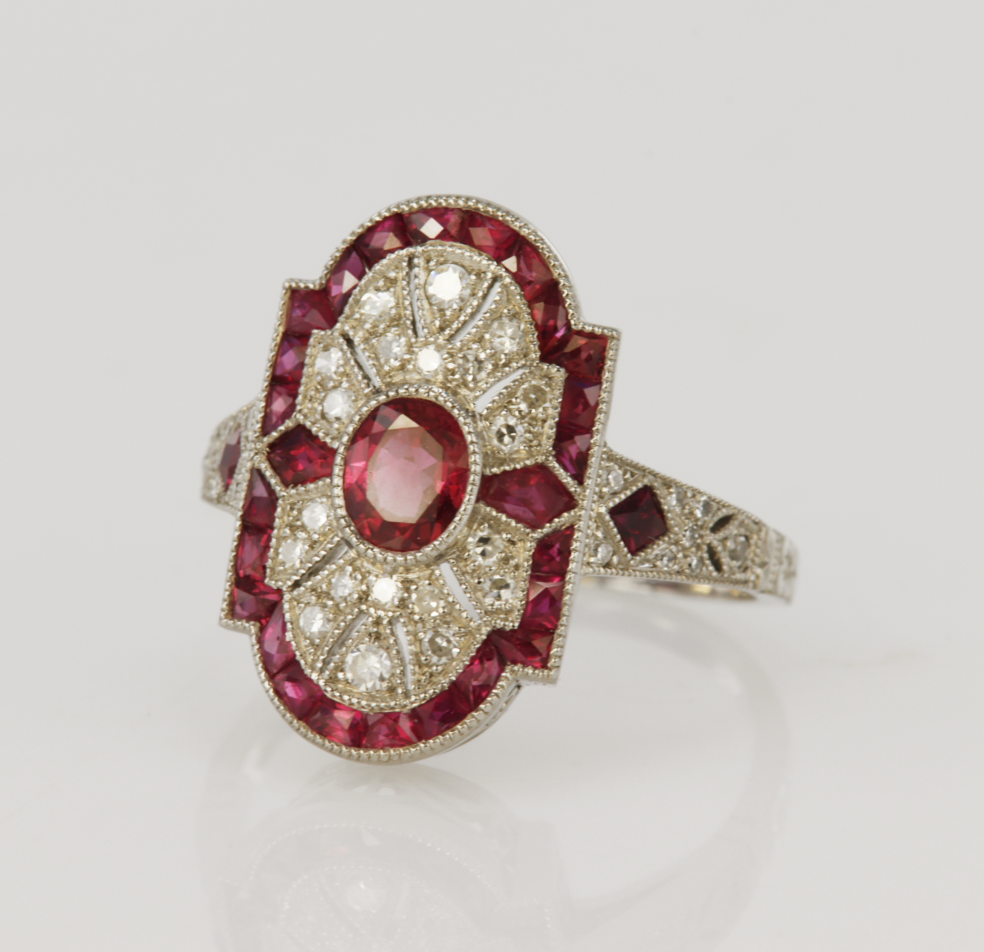 Platinum (tests 850 standard) diamond and ruby navette ring, principle ruby measures 5mm x 4mm,