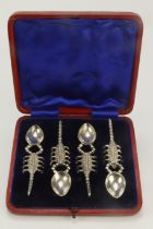 Boxed set of four silver plated spoons with scorpion shaped handles.