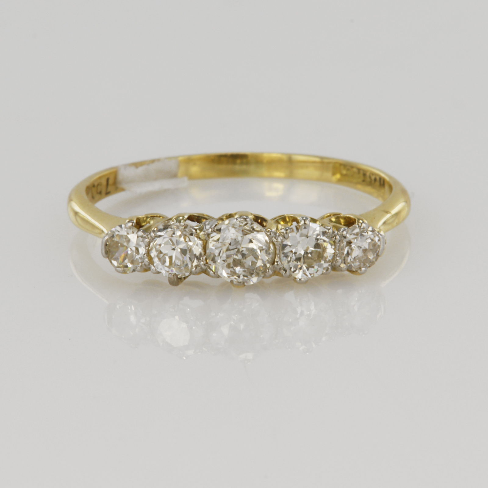 18ct yellow gold graduated five stone diamond ring, central round old cut diamond weighing approx.